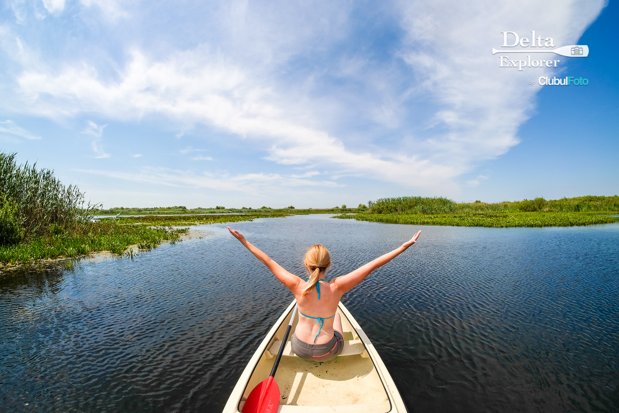 Woman enjoying Danube Delta in a boat Canoe